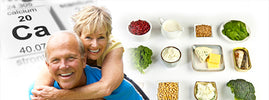 Smiling senior couple beside calcium-rich foods like dairy, beans, spinach, broccoli and sardines for bone health – SANUSq Health