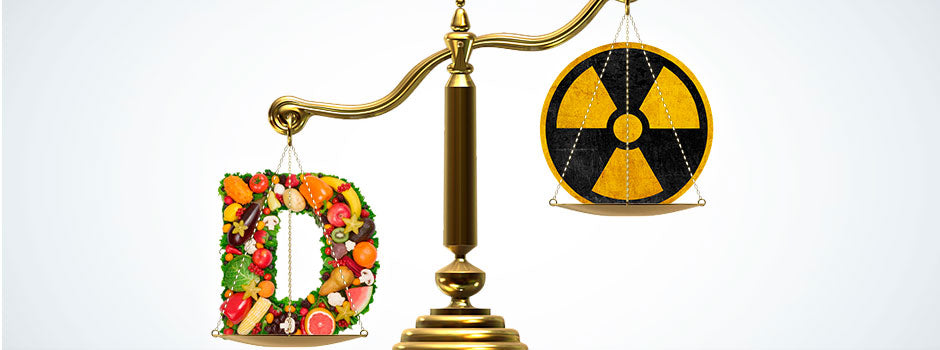 Balance scale weighing a letter D made of fresh produce against a radiation symbol, from SANUSq Health on vitamin D and radiation