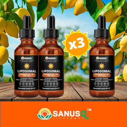 Three bottles of SANUSq Health liposomal Vitamin D3 + K2 vegan drops on a wooden table beneath sunny lemon branches