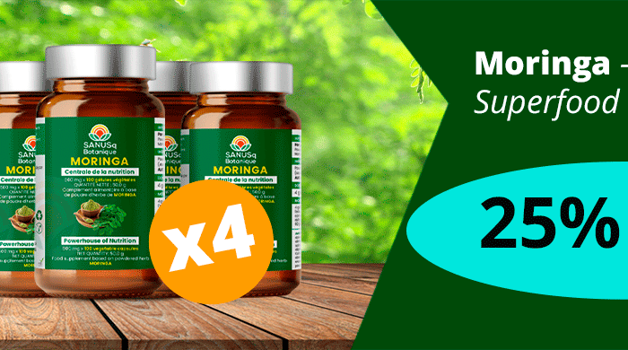 Four bottles of SANUSq Moringa leaf capsules on a wooden table: Moringa superfood bundle, 25% off